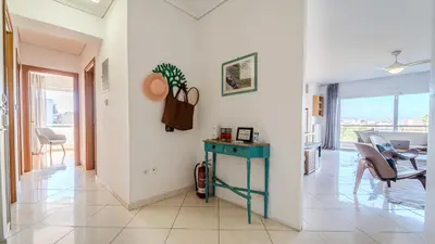 a living room with a table and a dining room at Piraeus Bright Apt in Piraeus