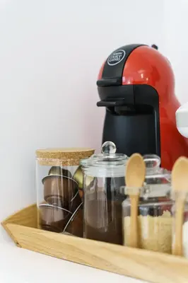 a wooden tray with a coffee pot and other kitchen utensils at Art Pantheon - Suites & Apartments in Athens