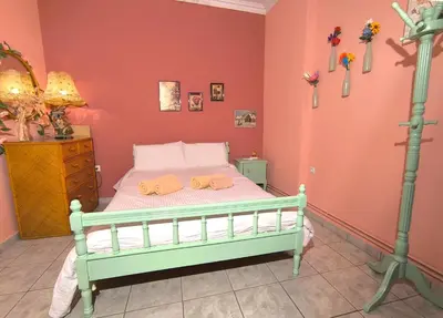 a bedroom with a bed with two towels on it at Casa Bonita, House with Private Entrance and Garden, between center and sea in Athens