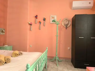 a bedroom with a bed with keys on the wall at Casa Bonita, House with Private Entrance and Garden, between center and sea in Athens