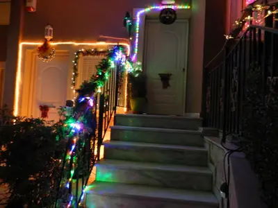 a house with christmas lights on the stairs at Stella's Home in Glyka Nera