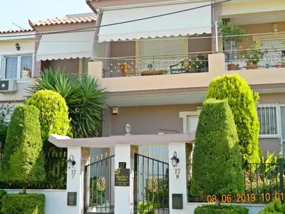 a house with trees in front of it at Stella's Home in Glyka Nera