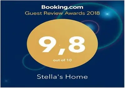a sign that says guest review awards with a yellow circle at Stella's Home in Glyka Nera