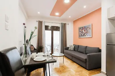 a living room with a couch and a table at Nicholas Point Apartments and Rooms in Athens