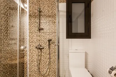 a bathroom with a glass shower with a toilet at Nicholas Point Apartments and Rooms in Athens