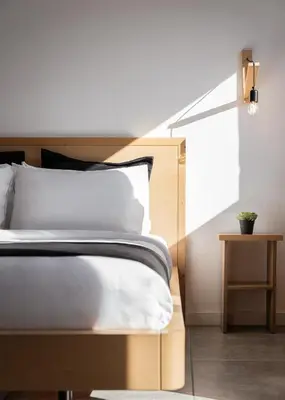 a bedroom with a bed and a lamp next to a window at Acropolis Cozy Living in Athens