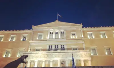 a building with a horse statue in front of it at Athens Luxury House in Athens