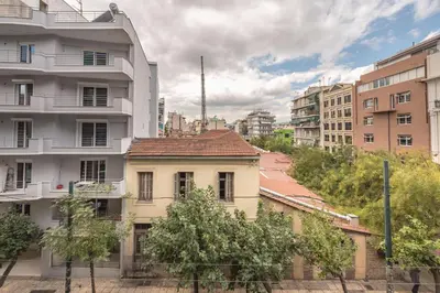 an apartment building in a city with buildings at The Athenian Apartment in Athens