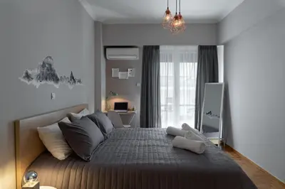 a bedroom with a large bed in a room at Eleana Apartment By The Acropolis in Athens