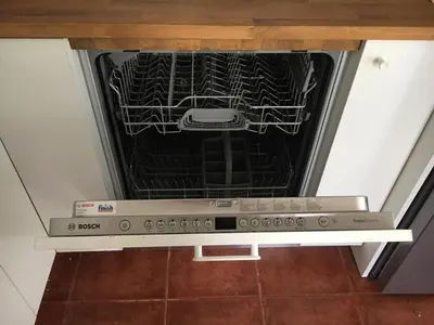 an oven with its door open in a kitchen at Villa Christina with private pool in Saronida, near stunning beaches, Athens airport & Sounio in Saronida