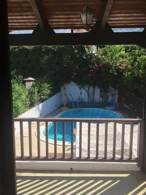a view of a swimming pool from a balcony at Villa Christina with private pool in Saronida, near stunning beaches, Athens airport & Sounio in Saronida