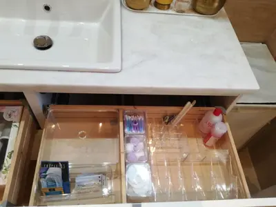 an open drawer in a kitchen with a sink at Maria's House in Athens