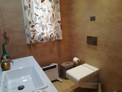 a bathroom with a sink and a toilet at Maria's House in Athens