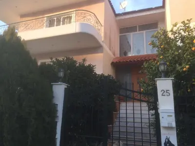 a house with a gate and a fence at Maria's House in Athens