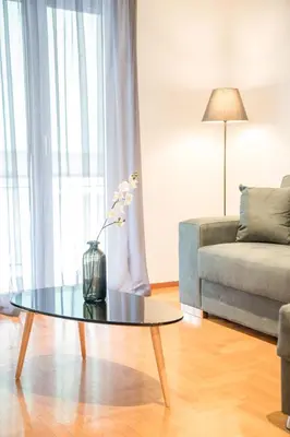 a living room with a coffee table and a couch at Modern design apartment near Acropolis 2 in Athens