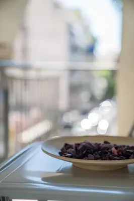 a plate of food sitting on top of a table at Modern design apartment near Acropolis 2 in Athens