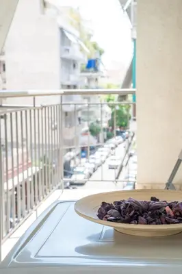 a plate of food on a table on a balcony at Modern design apartment near Acropolis 2 in Athens