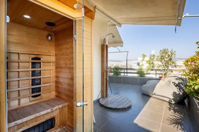 an outdoor sauna with a view of the city at The 1 and only Acropolis penthouse in Athens