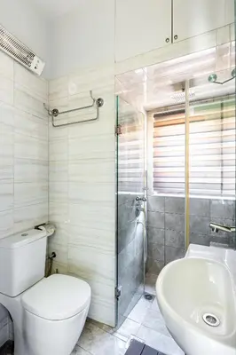 a bathroom with a toilet and a sink at The 1 and only Acropolis penthouse in Athens