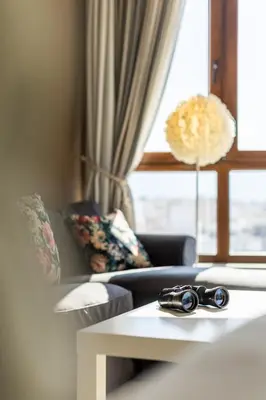 a living room with a couch and a table at The 1 and only Acropolis penthouse in Athens