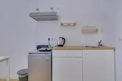 a kitchen with a stove and a counter top at apartotel.acropolis.view in Athens