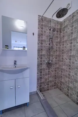 a bathroom with a shower and a sink at apartotel.acropolis.view in Athens