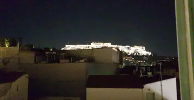 a view of the city at night from a building at apartotel.acropolis.view in Athens