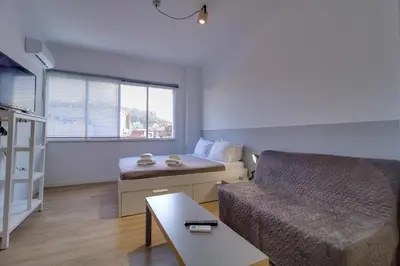 a small living room with a couch and a table at apartotel.acropolis.view in Athens