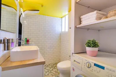 a small bathroom with a sink and a toilet at Spacious Central Flat☆3min to Metro☆AC|Netflix|PC in Athens