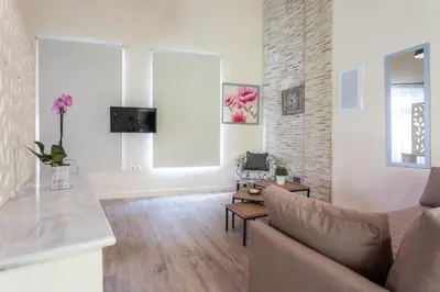 a living room with a couch and a table at Ancient Agora Apartments in Athens
