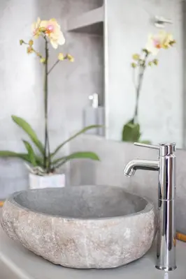 a bathroom sink with a stone sink at Ancient Agora Apartments in Athens