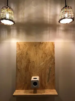a bathroom with a urinal with two lights on the wall at Stefanias sunny Acropolis Studio on Drakou pedestrian in Athens