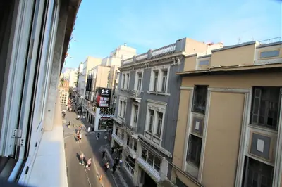 a view from a window of a street with buildings at Aiolos Apartments Suites Ermou 64 Monastiraki Plaka 2nd Floor in Athens
