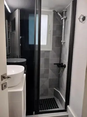 a bathroom with a shower and a sink at Athens Pangrati modern apt 10min to metro in Athens