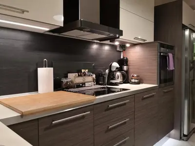 a kitchen with wooden cabinets and a stove top oven at Luxury Home in Spáta