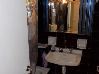 a bathroom with a sink and a mirror at George's Apartment in ''Pedion Areos'' area in Athens