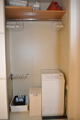 a laundry room with a washer and dryer at Vouliagmeni seaside flat in Athens