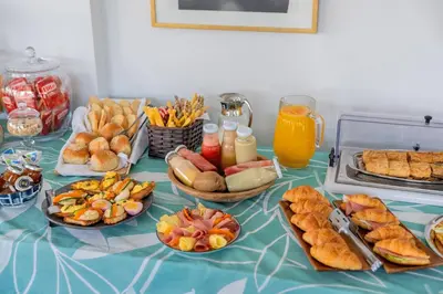 a table with many different types of food on it at Maison 66, Riviera Hotels in Athens
