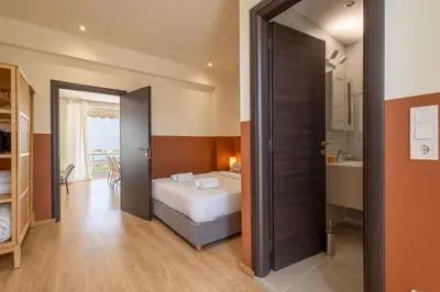 a bedroom with a bed and a bathroom at Luxurious 3-Bedroom Seaside Retreat Fully Renovated in 2025 in Athens