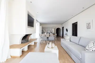 a living room with a couch and a fireplace at Luxurious 3-Bedroom Seaside Retreat Fully Renovated in 2025 in Athens