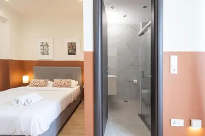 a bedroom with a bed and a shower at Luxurious 3-Bedroom Seaside Retreat Fully Renovated in 2025 in Athens