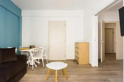 a living room with a couch and a table at Comfort Zone Apartment in the heart of Athens in Athens