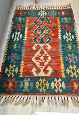 a rug on a table with patterns on it at ATHENS *BLUE GRAND SUITE *DI GIORGIO CENTRAL APARTMENT in Athens