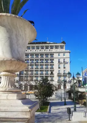 a large white building with a fountain in front of it at ATHENS *BLUE GRAND SUITE *DI GIORGIO CENTRAL APARTMENT in Athens