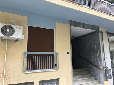 a building with a air conditioner on the side of it at El Pacífico in Athens