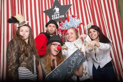 a group of people dressed in costumes posing for a picture at City Circus Athens in Athens