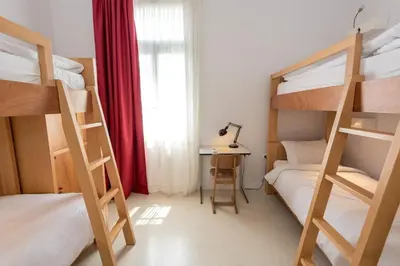 a room with two bunk beds and a desk at City Circus Athens in Athens