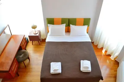 a bedroom with a bed with two towels on it at City Circus Athens in Athens