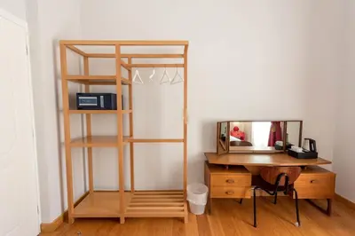 a desk with a mirror next to a desk with a shelf at City Circus Athens in Athens