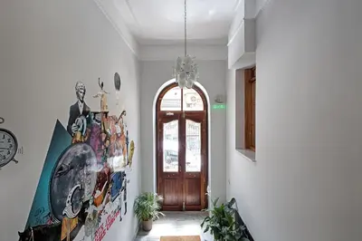 a hallway with a door and a painting on the wall at City Circus Athens in Athens
